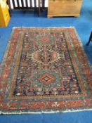 A Persian rug, 76" x 59"