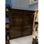 A walnut wall cabinet