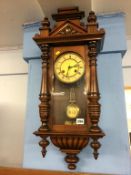 A mahogany wall clock