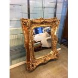 A large gilt framed mirror