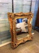 A large gilt framed mirror