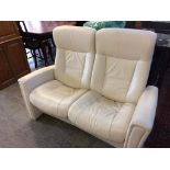 A leather two seater reclining sofa