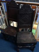 Two antique oak chairs