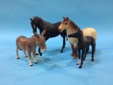 Four Beswick horses