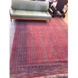 A red ground carpet square, approx. 100" wide