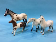 Four Beswick dappled horses/ponies