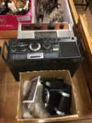 Two radios and a Polaroid camera