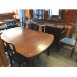 A mahogany dining room suite, comprising table, six chairs (4+2) and a sideboard