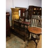 A coffee table, occasional table, two chairs and a gold chest of drawers