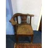 An antique oak corner chair