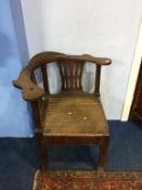 An antique oak corner chair