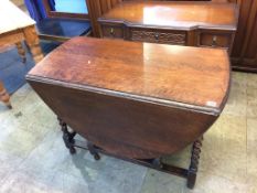 An oak barley twist gateleg dining table