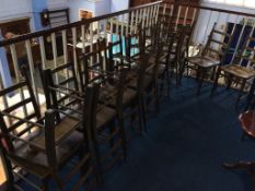A set of sixteen ladderback chairs