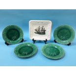 A Sunderland lustre plaque, and four Majolica plates