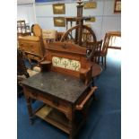 A spinning wheel, oak table and a washstand