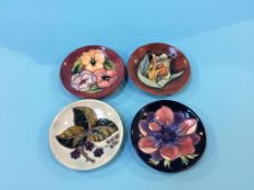 A collection of four Moorcroft pin dishes