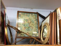 A shelf of prints and mirrors etc. Floral still life withdrawn