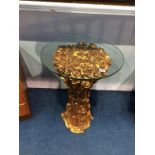 A gilded 'Rose' table with glass top