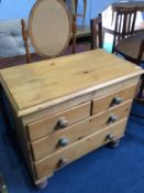 A pine chest of four drawers