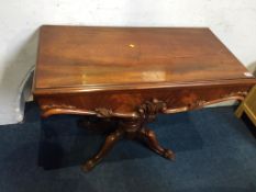 A Victorian mahogany tea table