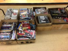 Seven boxes of assorted, DVD's etc.