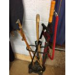 A cast iron stick stand and contents