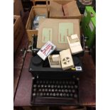 A typewriter etc.