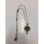 A 9ct gold pendant, mounted with seed pearls and diamonds etc. 6g