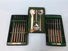 Three boxes of Viners Studio cutlery