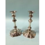 A pair of silver candlesticks, marks rubbed