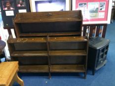 Two oak bookcases and an electric fire