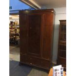 An Edwardian single door wardrobe