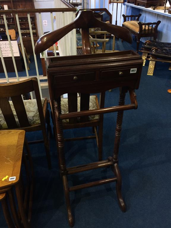 A reproduction mahogany valet stand