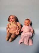 A German Armand Marseille doll, with composite head and another doll