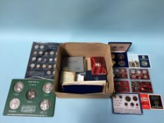 A box of various Commemorative coinage, to include 1999, 2000, 2001 US Mint Silver Proof Sets etc.