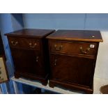 A pair of mahogany bedside cabinets