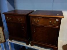 A pair of mahogany bedside cabinets
