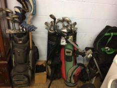 A quantity of golf clubs and accessories