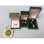 A pair of 9ct white gold earrings and necklace, and a jade pendant etc.