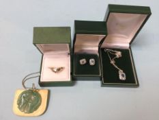 A pair of 9ct white gold earrings and necklace, and a jade pendant etc.