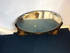 An Oriental design oval mirror