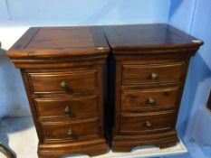 A pair of modern bow front bedside chests