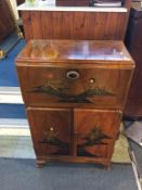 An Oriental decorated walnut cocktail cabinet