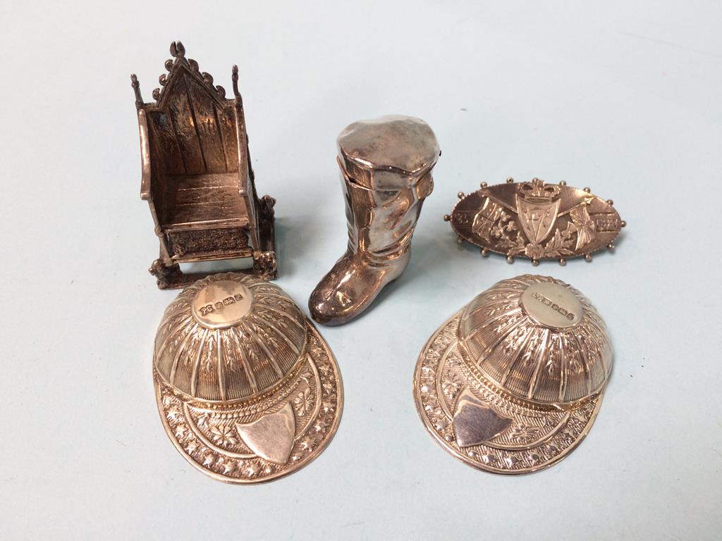 A near pair of silver Jockey Cap caddy spoons, a silver throne etc.