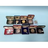 Ten various boxed sterling silver coins
