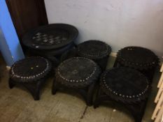 A reclaimed tyre circular table and five stools