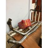 Harley Davidson exhaust pipes, forks and oil tank