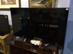 An LG 3D TV (Model number 47LM760T-ZB), with curved remote and 3D glasses