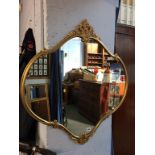 A gilt framed mirror