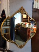 A gilt framed mirror